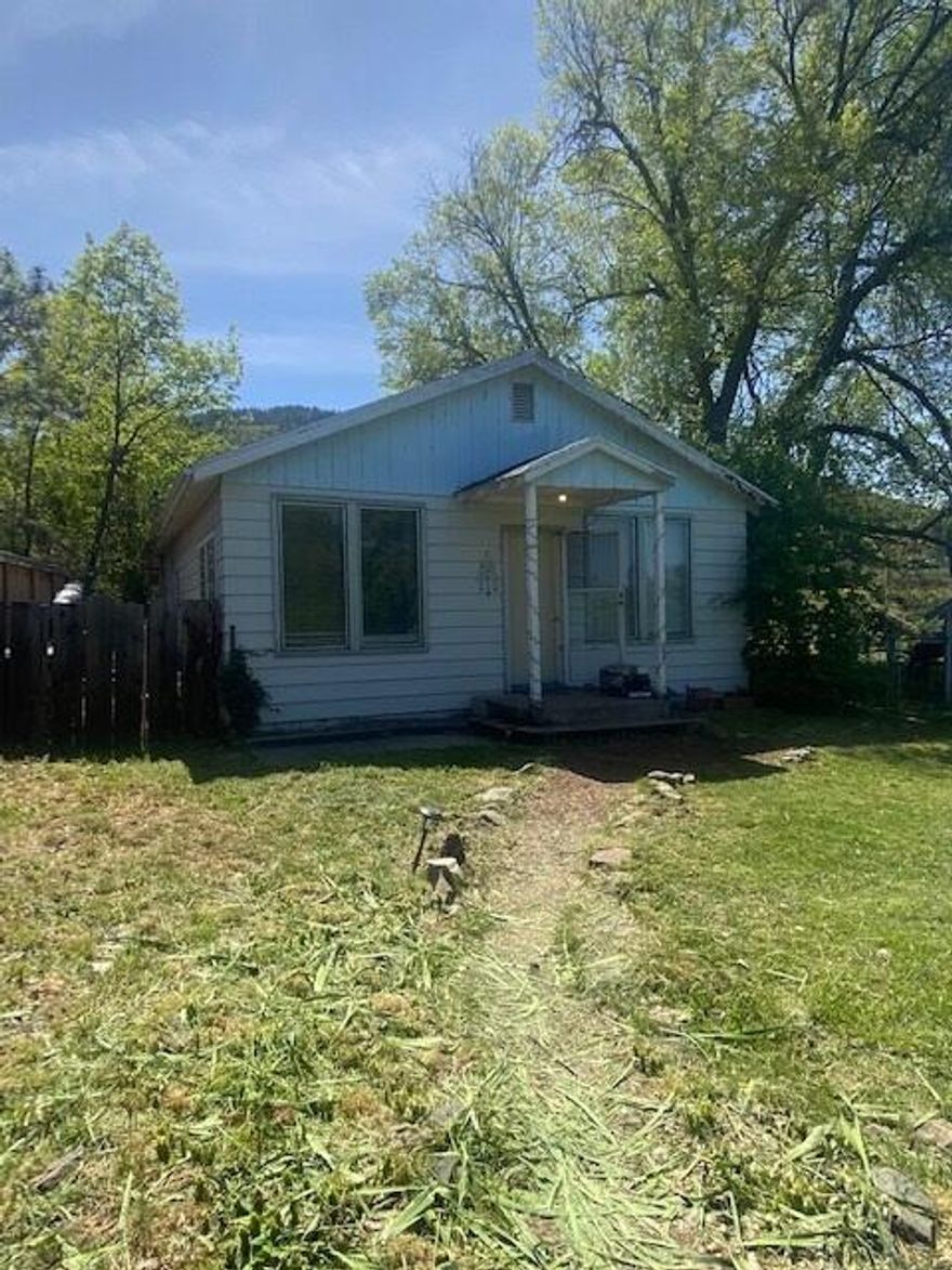 2 Bedroom 1 Bath home located in desirable Talent. Home sits on a larger .54 of an acre lot with Talent Irrigation Rights. Built in 1935 this 984 Sqft home is a within walking distance to Downtown Talent and about a five minute drive to Ashland. Great first time home buyer or investment property. Home is being sold As-Is.