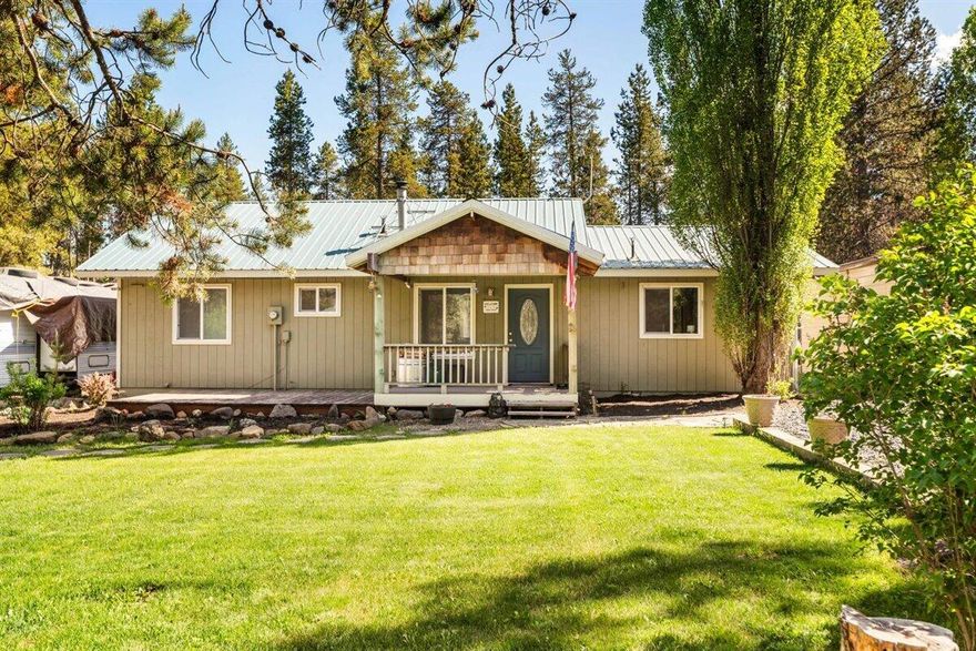 Tranquil retreat near La Pine State Park! This 2BR/1BA home offers an inviting open floor plan with updated kitchen - stainless appliances, tile backsplash, and handcrafted island. Beautifully landscaped oasis with fenced front yard, tree-lined backyard with deck/fire pit overlooking a lush lawn. Chef's kiss views from the kitchen! Wondering where to store your toys and vehicles? The detached 2-car covered carport is perfect for your daily drivers. For your weekend adventures and outdoor gear, the 24'x48' shop provides ample space among your tools and workshop essentials. The fenced-off shop area includes extra storage, complete with a charming chicken coop and a single-car garage. 

With easy access to the Deschutes River and just a short 30-minute drive to the renowned Mt. Bachelor and the vibrant city of Bend, this home offers the ultimate Central Oregon living experience. Indulge in outdoor adventures and return to your tranquil retreat, where comfort and serenity await.