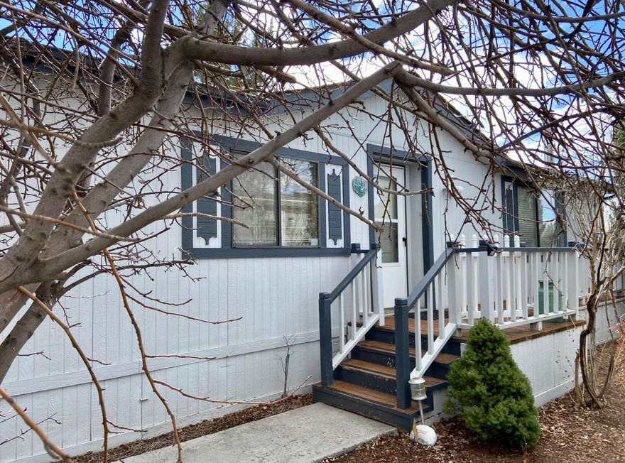 Located in the 55+ manufactured home community of Cascade Village in NE Bend.  Open floor plan with laminate flooring throughout main living areas and bedrooms.  Wood stove and central A/C help keep you comfortable year round.  Newer kitchen cabinets and quartz countertops.  Views of the mountains from the deck that overlooks the green belt.  Oversized 2-car garage.  Owner occupied only.  Space rent  includes clubhouse, pool, street snow removal and sewer.  Sale is for manufactured home only, land not included.  Park management must approve buyer.