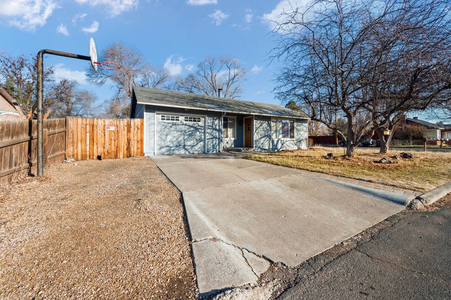 **Seller is offering $15,000 in credit for buyer to use as a 2:1 or permanent rate buy down.**Home is getting a brand new natural gas tankless water heater installed prior to closing. Nice stick built home in Madras. This three bedroom, one bathroom home sits on a large corner lot right across the street from the Madras Elementary School. It has been well maintained, with a nicely updated kitchen, featuring quartz counters, farm sink, tile backsplash and updated appliances. Nice laminate floor and carpet throughout. Fully fenced back yard with side street access and plenty of room for RV parking. Nicely landscaped yards with sprinkler system. The covered back patio is great for outdoor cooking and entertaining. Natural gas comes to the house but is not hooked to anything.