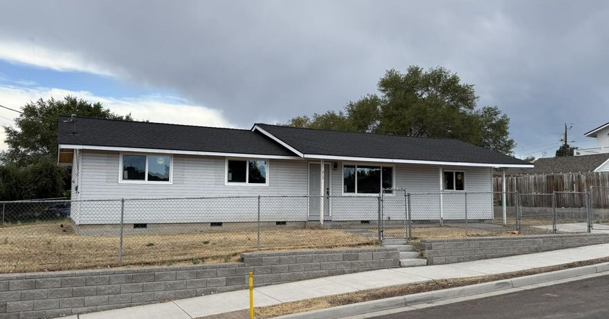 New everything inside this move in ready home. First time home buyers? Investors? This is a great opportunity. New roof, new flooring, new Pella windows, new doors, new cabinets, new appliances, new lighting, quartz countertops and more. This home even has a fenced yard with a large gate. There is even room to park vehicles or an RV next to the house. This is a four bedroom home ready for you.