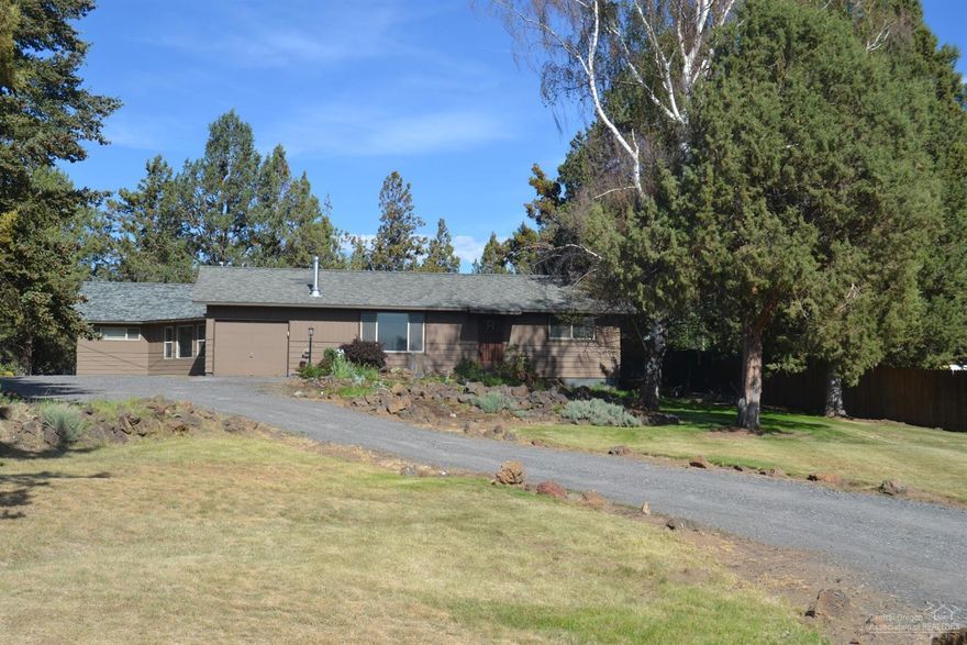 This desirable ranch style single level home is country living close to town. A large master bedroom suite w/comfortable living space separates the other 2 bedrooms. Multiple water features, underground sprinklers, acre of irrigation & a large concrete patio make the backyard great living space in the summer. Peekaboo Mtn views from living room, new wood stove & RV parking are just some of the features of this great home. A large shed w/lights & power provides space for small projects or storage for toys.