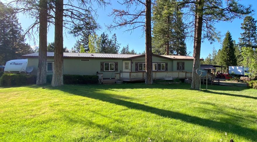 Beautiful, treed acreage this 3-bedroom 2 bath MFH sits on 3.22 acres. You can enjoy the beautiful surroundings of nature and wildlife from your very own spacious deck. Property is fenced with room for 4H animals or pets. Detached garage with workspace and extra room off garage, tack room, man cave, lots of room for your RV and toys This home is the total package!!!!!!!