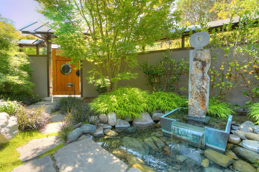 Stunning, one of a kind, quality and taste throughout this architecturally designed and masterfully built home on close in 6.3 ac. The single level design takes advantage of panoramic views of Ashland, East hills and both Table Rocks. Built in 2006 this 3984 SF gracious home offers solid African mahogany, Peruvian walnut & other striking woods throughout. Handmade, custom features abound in the open floor plan, gourmet island kitchen designed for maximum efficiency & handmade cabinets meshes seamlessly w/ the Great & Dining Rooms. Vaulted primary suite is an oasis set at one side of the house for ultimate privacy & peace. Dream walk-in closet w/ built ins, limestone bath floors (heated) and counters, and walk-in shower with all the detail you would expect in a home of this stature! Stream runs under house with glass floors inside & out, generous covered patios surround the view side w/ outdoor kitchen, automated screens, entertaining area and so much more. Just too much to describe.