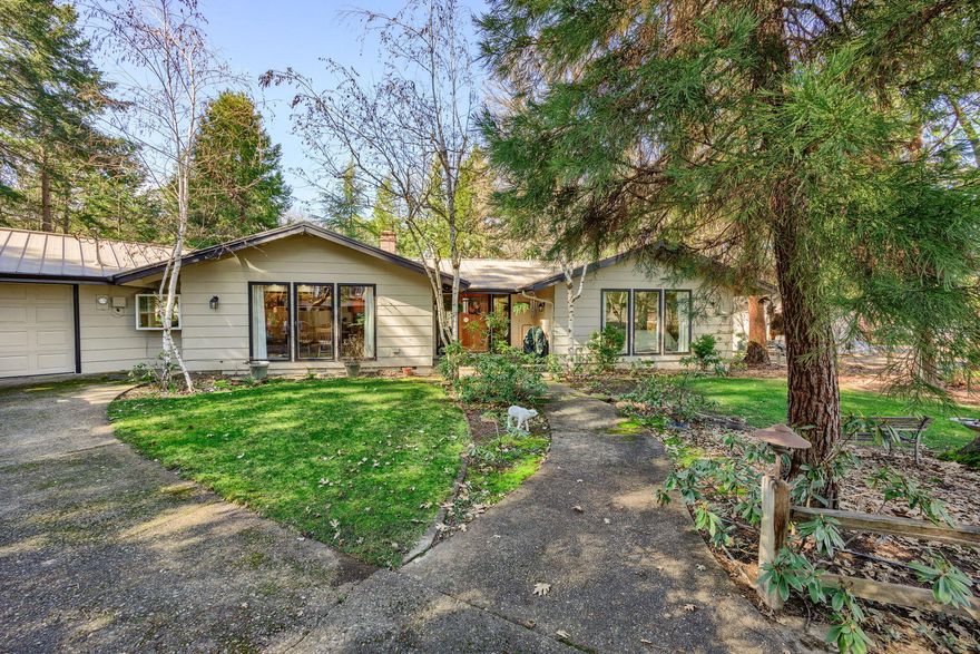 BACK ON MARKET, NO FAULT OF PROPERTY! Septic pumped and checked (well 32 gpm). Home is open and bright, step down living room with wood fireplace, the gourmet kitchen has been updated with granite countertops,new cabinets (lots of them!), hardwood floor,instant hot. Dry bar, wine rack, double oven, 2 car attached garage. Sunroom off kitchen could be a third bedroom or family room, apprx. 350 sq ft. not included in total sq st.. Attic fan on a thermostat. Master suite has a jetted tub, cedar lined closet, double vanity. PLUS 24x50 shop, incl. overhead trolley crane, 240 power (for welding) and 110 power, 4 cylinder compressor with magnetic starter, large sliding door for easy access. Newer metal roof. Door height 9'2'', shop ceiling height 10' 2012 well went from 80' to 200' and 30 GPM. New 2 hp27 GPM well pump installed July 2019. Open pastures in front of property, back part (where house sits) is natural, lots of trees including peach, apple, plum and pear tree