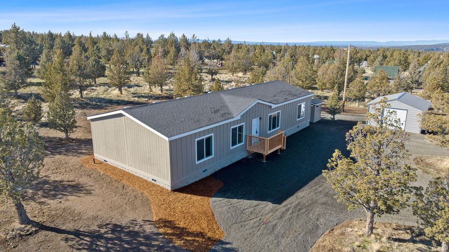 Move in ready! This beautiful, brand new, 4 bedroom, 2 bath home on 2 spacious acres features an open floor plan, large kitchen with island and large pantry, stainless steel appliances, knotty alder cabinets, and large utility room with utility sink; in addition to a large deck, 20 x 18 sf detached garage, and a private well.