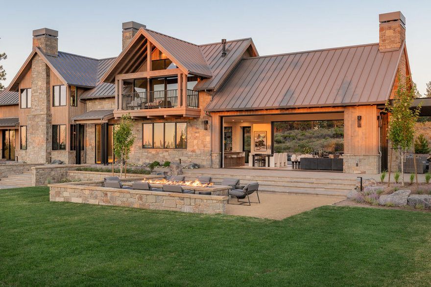 COBA 2024 Winner: Architectural Design, Interior Finish, Best of Show, Kitchen, Landscaping. The list goes on. Deschutes Custom Homes brings you this luxury entertainer's dream, situated on the west side of the prestigious Westgate subdivision. The 1st floor great room welcomes you with soaring ceilings, two 24' sliding pocket doors for the ultimate in indoor/outdoor living & see-thru fireplace to the side patio. Downstairs also boasts a unique library, bright office & guest quarters. Chef's kitchen includes a Café double oven, two dishwashers, wine fridge, separate serving station & quartz waterfall countertops. Upstairs brings an additional living area, primary suite with mountain views from the private balcony & three additional bedrooms. Outdoor area includes a gas firepit built for gathering with Cascade Mountain views & an enormous back patio with outdoor kitchen and seating for eight at the wraparound bar. Come make your high desert dreams come true with this piece of paradise.