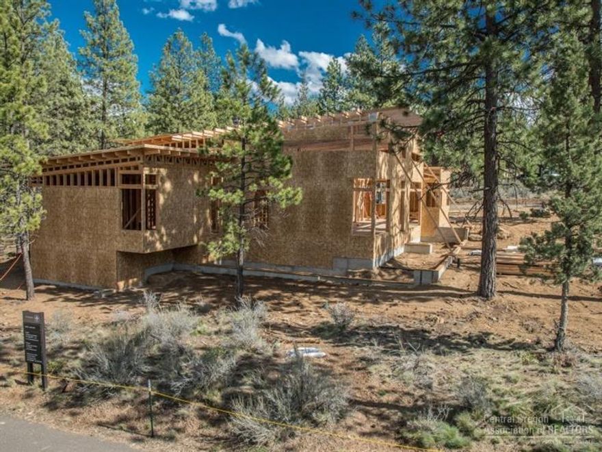Timberline Construction of Bend has collaborated with Bend architect Brandon Olin to design this contemporary home at Tetherow Golf Club. The home is organized to take advantage of passive solar gains and is designed as a single level. This custom quality home offers 3 bedrooms, 3 baths, den office plus a bonus room. The two car garage bay features a bonus tandem space. The large wrap-around deck offers indoor-outdoor connections throughout the open floor plan layout. Built to Earth Advantage.