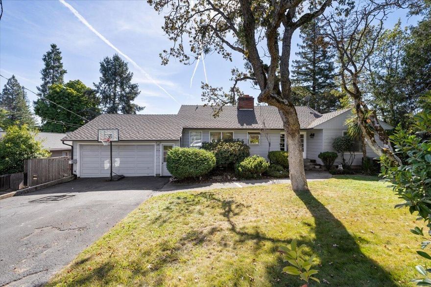 Step into this beautifully designed home crafted by the renowned Frank Clark, and located in the heart of Old East Medford!  This spacious residence seamlessly blends timeless design with modern updates.  The upstairs offers 3 generous bedrooms and 2 full baths, while the downstairs features an extra living space and 2 additional bedrooms, both with private en suites, making it ideal for guests or multi-generational living.  Recent updates include a spacious covered deck, perfect for year-round outdoor entertaining and relaxation.  The home also features newer added mini-splits on both the upstairs and downstairs levels for maximum comfort. Conveniently located, close to schools, shopping and medical facilities.