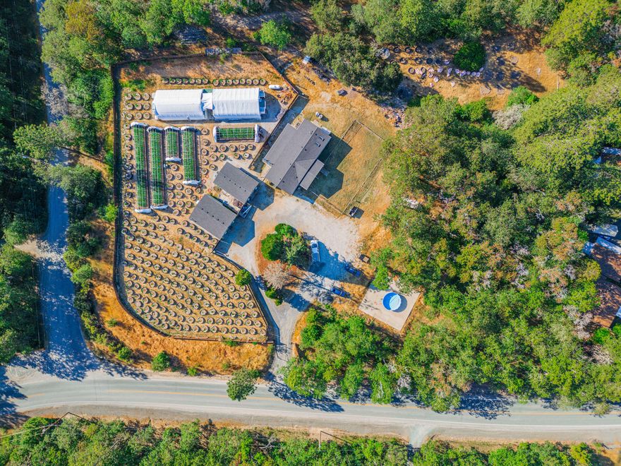 Back active no fault of property. Discover the potential of this exceptional Tier 2 cannabis farm in Southern Oregon, featuring diverse growing methods: full-term, light deprivation, and light-assisted greenhouses, all thriving in prime conditions. Ideal for market entry or breeding, with no nearby farms ensuring privacy and minimize risk of pollen drift. Water is sourced from an on-site well with a permit and stored in four 2,000-gallon in-ground concrete tanks. Facilities include a dedicated dry building and a versatile clone/mom building. The 1,708 sq ft, 3-bed, 2-bath home is perfect for employee housing or an owner-operator. This boutique farm's size ensures cost competitiveness, market agility, and the capacity to meet customer demands. Owner is open to many different options, from partnerships to owner financing with favorable terms so inquire today! Owner carry terms $150,000 down /5yrs @ 8%.