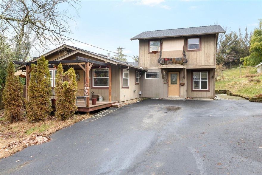 Opportunity Knocks! So much potential here on this large 0.93-acre property. Potential 
to fix up and flip with plenty of ''meat on the bone'' or live in it and enjoy. Seclusion & 
privacy on this large lot, very country setting yet just minutes from town. Surrounded by 
large trees, large separate fenced grassed area, irrigation water rights, +much more. 
Truly endless potential. There are 3-bedrooms, nice sized living room, nice sized 
kitchen, and a separate attached area that's been added which is super nice; walk 
through the laundry room to a charming, self-contained one-bedroom studio featuring a cast-iron tub & built-in shower, perfect for guests or extra income potential. The sellers 
also recently added a permitted huge, detached garage/shop (30x32 ft) two-story with oversized garage bottom and huge unfinished upstairs. So much potential here. 
Additional detached shed as well. Situated within the highly sought-after Griffin Creek 
school district