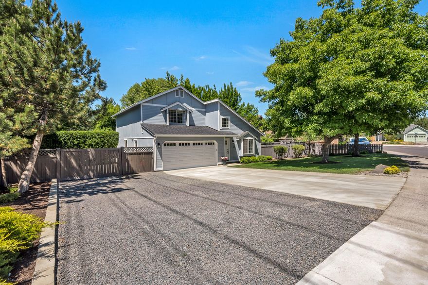 No detail or surface has been overlooked in this fully remodeled NE gem. This Providence community home mixes timeless style and design with a functional floor plan. The main level includes a spacious family room with vaulted ceilings and warm light, office with outdoor access, open living/kitchen concept with fully remodeled kitchen including SS appliances and solid surface countertops. Head up the stairs with custom banister to the primary suite including a luxurious bathroom remodel; dual vanity, tiled shower, walk in closet. Two more comfortable bedrooms with a fresh new bathroom round out the upstairs space. This flat, private lot has been meticulously landscaped & cared for with mature trees, water feature, patio & RV parking with fresh gravel pad. Additional upgrades over the last year include a new roof, freshly painted interior and exterior, new exterior trim, new lighting package, new garage door & opener, gutter downspouts & more. The work has been done, come inside & enjoy!