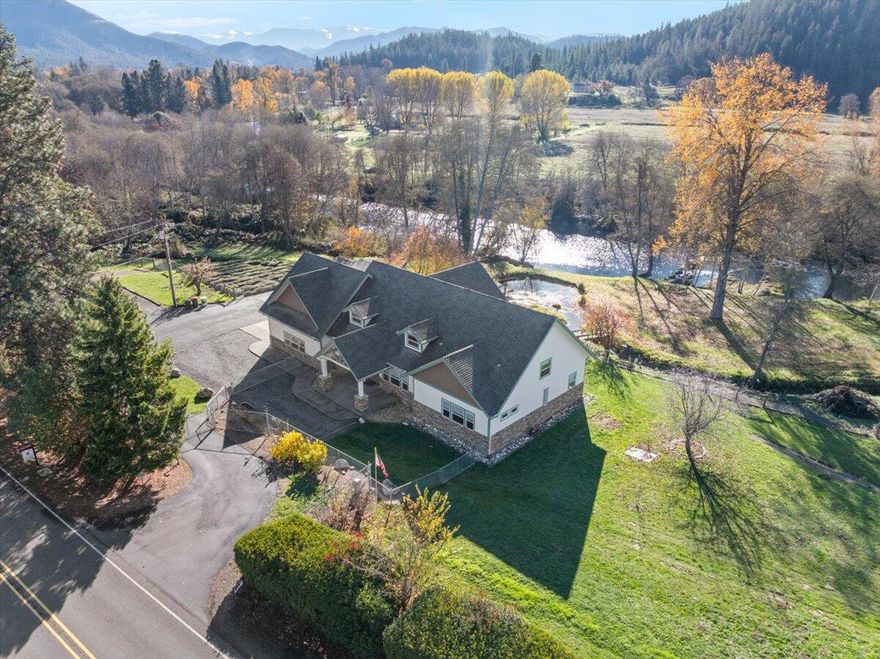 Riverfront property in wine country 13 minutes from downtown Jacksonville! This 3125 SqFt Custom home sits on 6.37 Acres, has 1000'+ of Applegate river frontage, paved drive with automatic gate, low property taxes, Backup generator, multiple outbuildings, and fenced/cross fenced property. Inside the home, notice the river views, and single story living. The Kitchen comes with SS Appliances, granite counters, pantry and is open to the great room and breakfast nook. The master suite boasts 2 walk in closets, tile shower, linen storage, dual sink vanity and toilet room with its own sink. The two hall bedrooms share an oversized Jack and Jill bathroom that includes 2 separate toilet areas and a shared sink and shower room. Upstairs has a massive attic storage area, and a heated/cooled bonus room above the 2 car garage with it's own ½ bath. The backyard is park-like with plenty of flat ground, river access, pond, lavender field, and multiple outbuildings. Schedule a tour today!