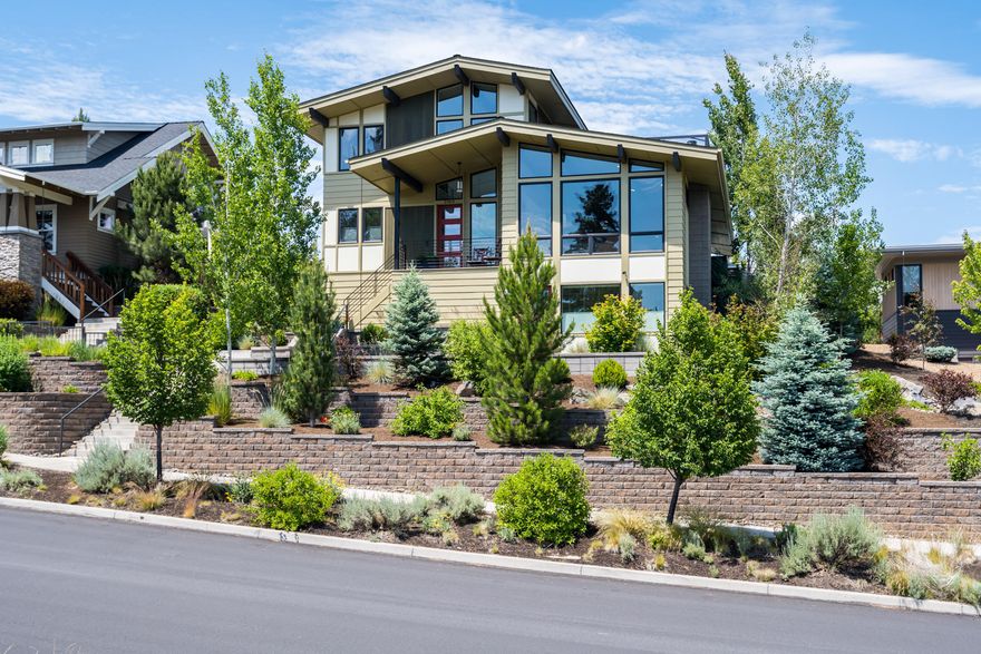 Live in the hottest NW Bend neighborhood, close to all the amenities, yet enjoy privacy and views of open space instead of other homes! This modern show stopper is perched high above the street in one of the newer phases of Northwest Crossing, close to the Galveston Ave corridor. With 4 bedrooms, 3.5 bathrooms, the 2572 SF lives large and is perfect for full time living or your own getaway in Bend, Oregon. Master is on the main level, enter through the garage with no steps. There are two bedrooms, bathroom and bonus space upstairs and one bedroom/bathroom downstairs with a separate entrance, making it a nice home office space as well. Huge vaulted ceilings and windows in the great room bring in tons of south facing light. With over 40K in landscaping upgrades the last few years, you can enjoy your own private backyard oasis. All this plus 20K in solar panels help the utility costs as well as the planet. Be sure and watch the Matterport 3-D tour as well.