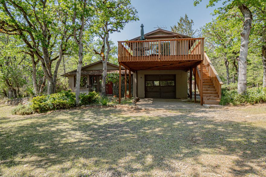 Nestled on 4.10 acres in a gorgeous, park-like country setting, this charming 2-bedroom, 1-bath home offers 1,606 sqft of well-designed living space plus a spacious bonus room above the garage—perfect as a 3rd bedroom, man cave, or additional living area. Enjoy the natural light from bay windows, built-ins for added character, office space, and dining area. Fresh interior paint, stainless-steel refrigerator, and new microwave. Step outside to a large deck off bonus room overlooking landscape, built in 2023—ideal for relaxing or entertaining. Explore your own land, hunt for morels, garden in the greenhouse, shed for storage. Property offers tons of potential in a fantastic location.