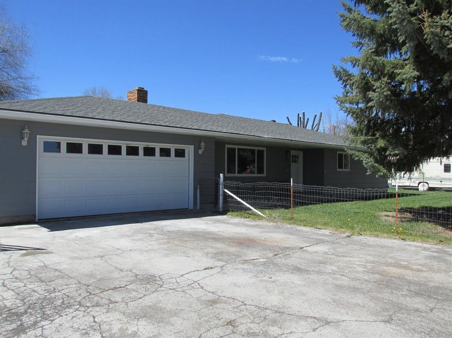 Nicely updated home in the suburbs with 1.71 acres! Kitchen and both bathrooms have been updated with new cabinets and granite counter tops. New septic system, roof, interior and exterior paint, light fixtures and floor coverings. This 3 bedroom 2 bath ranch style home has a living room, family room with 2 bay windows plus a 2 car attached garage. Fenced back and front yard with KID irrigation. Nice deck in the back. This is a Homepath property.