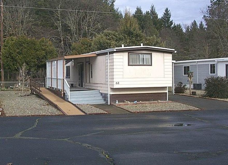 Must have a BCD license to list or seller mobile homes only. 55+ park in Cave Junction with space rent currently at $260. which includes water, sewer and trash! This single wide is 14 x 66 with open living room, step up dining area and kitchen. Master bedroom has its own bathroom for that privacy. This home is 2 bedroom 2 bath with approx. 924 sq. ft. of living space. Added bonus is nice sized covered deck on West side of home and a handicap ramp already in place.