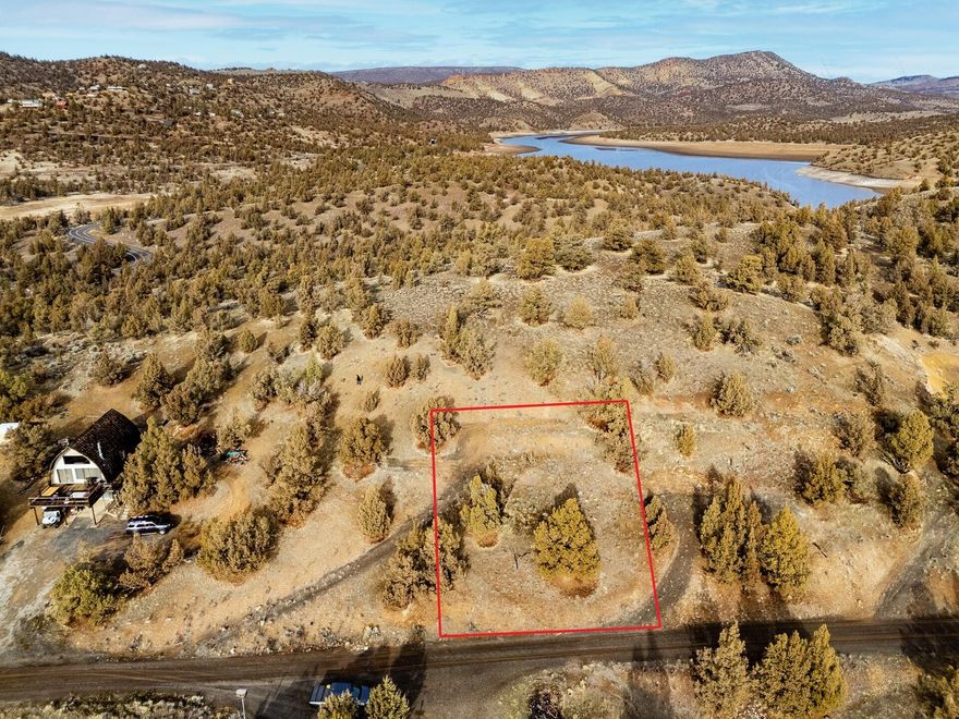 Stellar Prineville Reservoir views from this .25 acre buildable lot on Vista Loop in Bottero Park. Sits at the top of the knoll with huge views on three sides and borders BLM on the back. Seller owns an adjacent property and will sell separately or together for a discounted price. Power is at the road. Septic was installed in 1980, Buyer's to own due diligence for their specific use. Water is provided by a community well. Buyer to be responsible to deliver to home site. Just minutes to launch your boat from Jasper Point or Prineville Reservoir State Park and enjoy a full day of water activities. Bottero Park offers a community water district, fees are $50 per year for lot only, no restricted use. Great vacation get away to enjoy the outdoors, perfect to relax after a day on the lake! Property backs to BLM on North side.