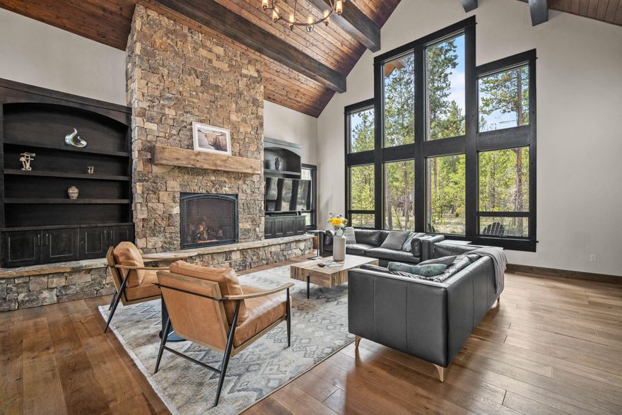 Timeless Caldera Springs design welcomes you with a grand, trussed entryway and stacked stone bases. The Great Room boasts stunning floor-to-ceiling windows offering panoramic views of the expansive common area. Rich, dark wood and massive stone fireplace evoke a Cascadian ambiance. Entertainers will delight in the spacious kitchen/dining area with a large center island, perfect for gatherings. The ground floor features the luxurious Primary Suite, two additional suites, and a powder room, with a convenient utility room adjacent to the three-car garage. Outside, a sprawling patio with hot tub and firepit extends from the Great Room. Upstairs, discover another suite, bonus room, and bunkroom ideal for children. Exciting amenities await with the Eastern Expansion and nearing completion of the Forest House recreation center. For nearly 20 years, Caldera Springs has upheld the cherished traditions of Sunriver. Start your own traditions today in this remarkable community.