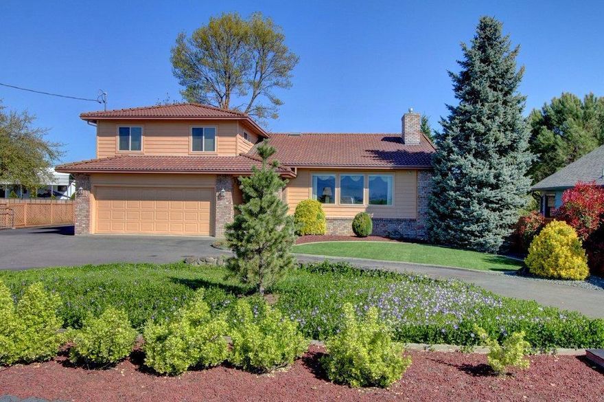 Exceptional 1-Owner, Mint Condition, Move-In Ready Home, TWO Masters, Tons of Upgrades & Extras, Huge 3 bay shop with 11' doors & loft space. Too many extras to list all. Vaulted ceilings, Pella wood French door with built-in blinds, high end dual-pane windows throughout, ceiling fans in all bedrooms, lots of extra storage, huge laundry/sewing room, beautifully remodeled kitchen with custom cabinets & Corian countertops, separate living and family rooms, Spanish-style tile roof & the huge Gourmet kitchen boasts a pantry and pull-out lower cabinets. Both baths have separate tubs & showers with dual shower heads in master. Master suite has jetted tub with inline heating, walk-in closet, walk-in shower & 2 sinks. There's RV parking with 3 hookups & an attached, oversized two-car garage. Fully fenced & landscaped yards with mature foliage. Must tour!