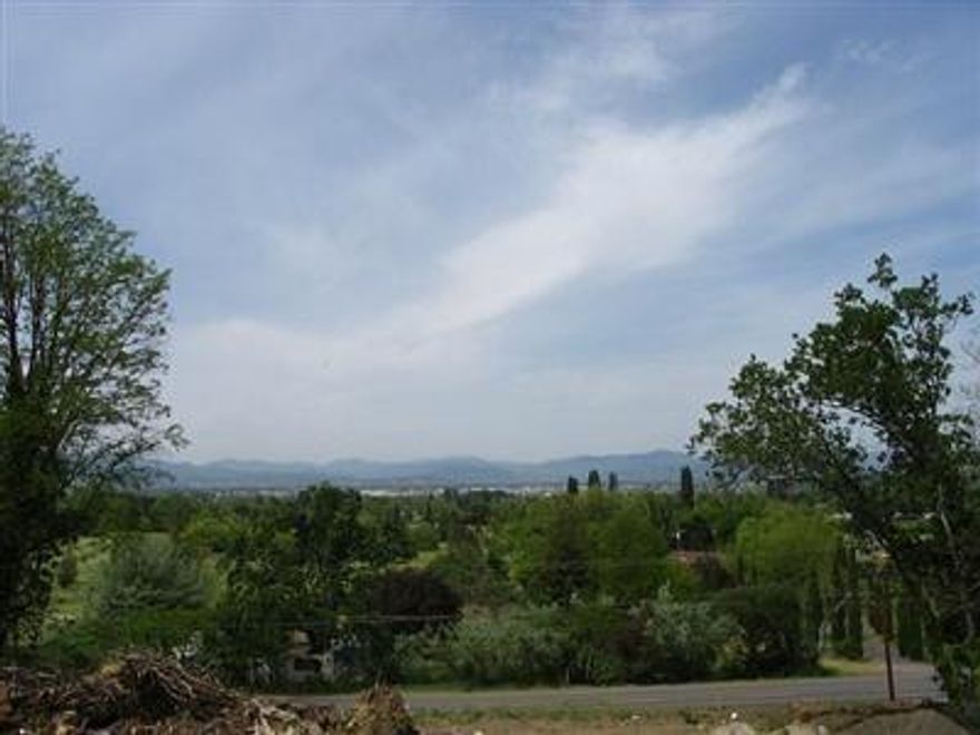 Build your Dream Home on this large view East Medford lot. Medford city lights and mountain views. Located in an area of beautiful homes on dead end street and close in. Lot is sloped allowing for a daylight basement or recreation vehicle garage. Owner is licensed Real Estate agent.