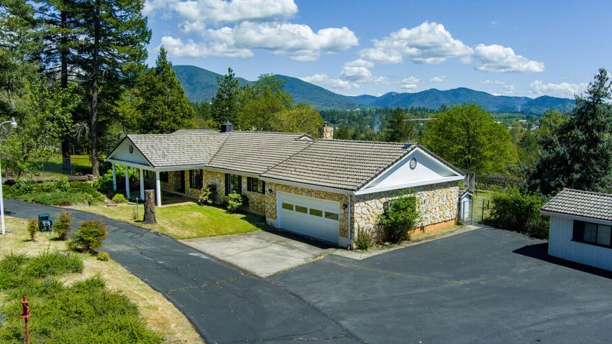 CASH ONLY- This beautiful home has major potential! Beautiful surroundings, great location, strong well at 16 gpm, smart layout and space for everything! Bring your boats, collectable cars, or toys to this 5-car setup. Thoughtful semi-open floor plan with a family room, living room, formal dining, breakfast nook, spacious kitchen, canning room (or more shop space, storage). On nearly 2 ACRES, set off a quiet street, and fully fenced and gated, and it's waiting for YOU! Featuring a wood burning fireplace, newer hardwood floors, tile roof, updated heat and air, brand new gas range, security system, utility sink, covered front porch and a graciously large covered back patio, gazebo, level lot with lovely landscaping, and so much more! 
Attached 2-car garage, detached 3-car garage, boat and RV carports, plus plenty of shop and storage space. Some ceilings and walls have been opened up for future repairs. The home will need a new roof. Many bids on file. Definite potential!
