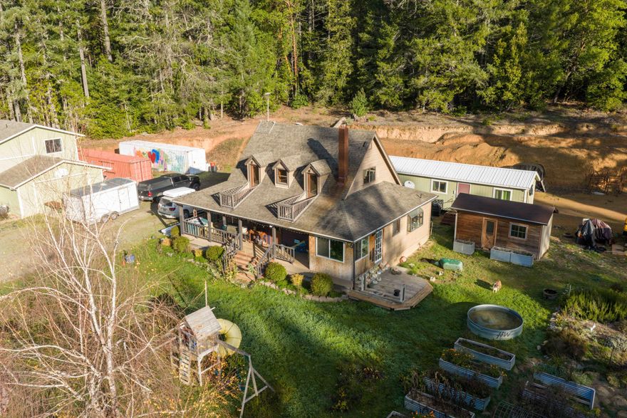 Beautiful property located minutes away from the picturesque Lake Selmac in gorgeous Southern Oregon. With two houses peacefully nestled amongst Oregon's natural beauty. Property offers a well-established garden, a shared gated entry, and plenty of space to fulfill your visions.  
A must see, don't miss out on this rare opportunity to own 159 acres of private oasis with 2 homes!  Priced to sell quickly. Seller is motivated, bring all offers!