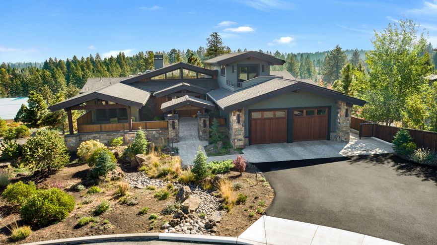 Designed for seamless indoor-outdoor living, this architectural home has endless, detailed custom features and territorial views.  Located at the end of a cul-de-sac near Deschutes River, trails and Mt Bachelor; a welcoming entry courtyard with a gas firepit leads you to a vaulted great room with floor-to-ceiling windows, doors that open to an expansive rear deck and hot tub.  The gourmet kitchen is a chef's dream with double ovens, a huge granite island, second sink and walk-in pantry.  A separate dining area opens to the deck with the main level also providing a den (could be add'l bedroom), laundry room, mudroom and primary en-suite with deck access and two walk-in closets.  The spacious lower level has two en-suite bedrooms, family, bonus, wine rooms, laundry, golf simulator room, mechanical room, access to the lower paver patio and a 5 hole SYNLawn putting green.  A third-level aerie used as a private office and mountain view deck. A 4-car tandem garage offers tons of storage.