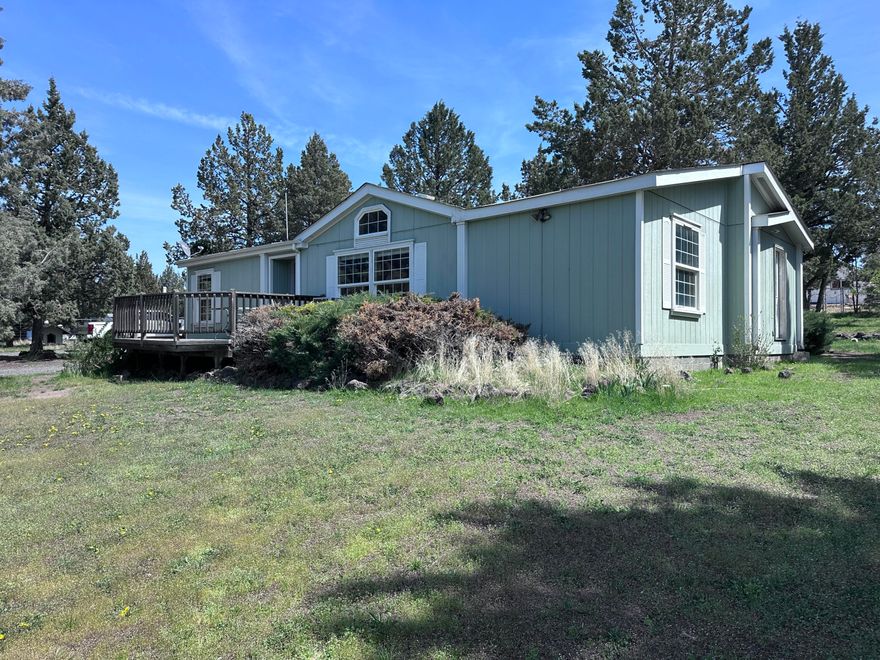 View of Mt. Jefferson! Spacious 1996 manufactured home on 1.03ac lot with amazing view of Mt. Jefferson. Vaulted ceilings, primary suite with soaking tub, shower and skylight. Bright kitchen and dining room with french doors leading to deck and sport court. Enjoy gardening inside the large greenhouse, with attached tool shed. Extensive sprinkler system for lawn and garden.