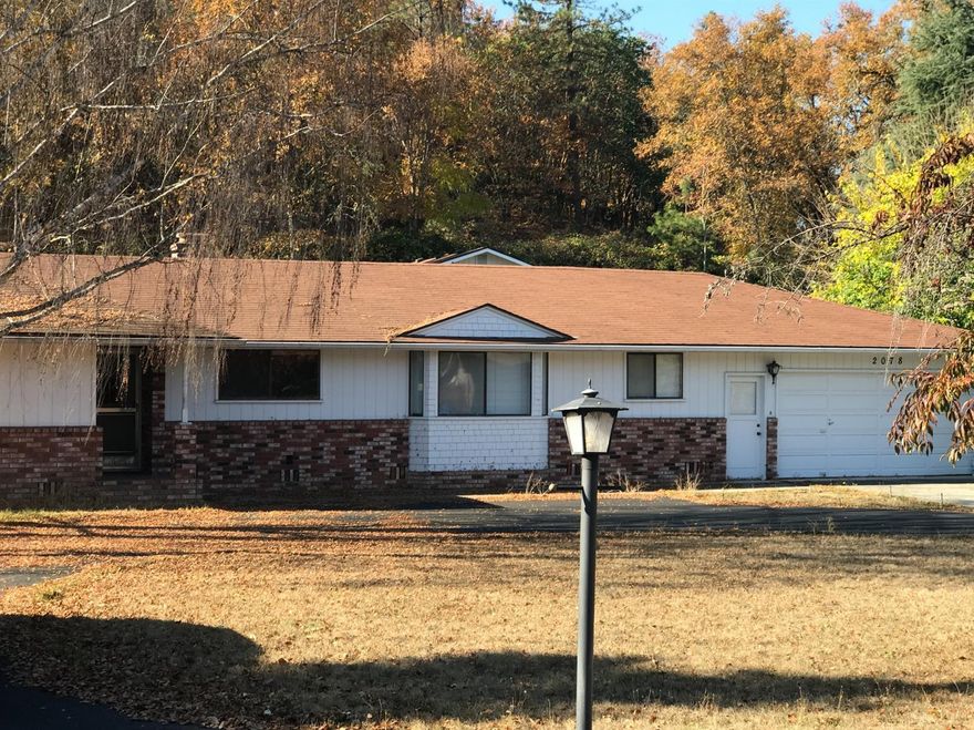 This classic ranch style home has been lovingly cared for for many years by it's previous owner. It features 2 master suites, a large laundry room with a walk in pantry, a 2 sided fire place in the living room, and a library that could be used as a 3rd bedroom. This property has a wonderful shop with a loft, storage area, and RV parking. Come check this classic out for yourself.