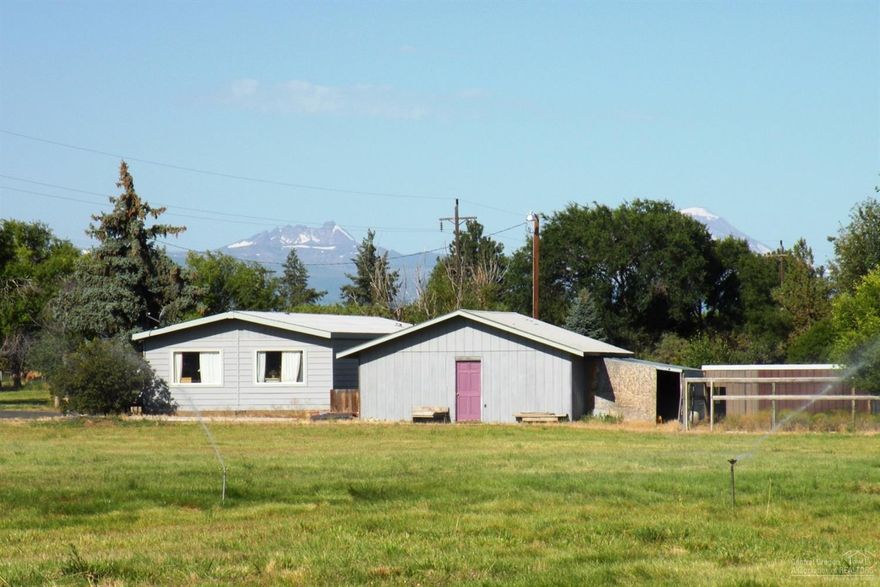 Desireable small mtn- view acreage with easy access to Bend & Redmond. 4.73 acres w/3.6 acres COIC irrigation and a 2 bed, 2 bath manufactured home plus pond and multi-use outbuilding. The property offers a ''clean canvas'' for your imagination to create your dream farm. There's potential for a variety of uses from organic farming and farm stand to hobby farm or nursery. Take advantage of a rare opportunity to ''build it your way.''