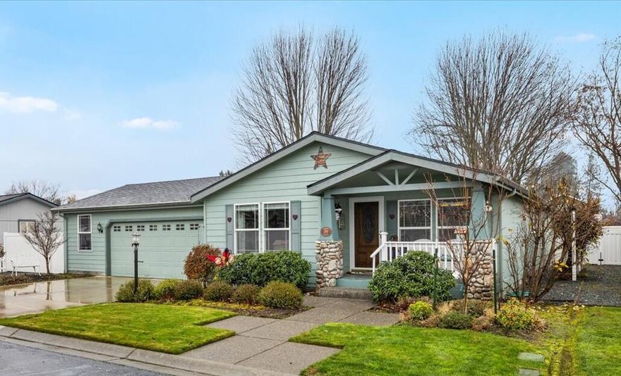 This charming 2002 manufactured home in the Miller Estates 55+ community offers 1,690 sq. ft. with a primary bedroom, 2 full bathrooms, & a 2nd room perfect for an office/den or guest bedroom. The finished, oversized 2 finished-car garage sits on one of the larger lots, complete with a garden shed, garden area, RV parking, and automatic sprinklers in the front and back. Relax on the covered front porch overlooking the beautifully landscaped yard. Inside, you'll find a welcoming front living room, dining area, & newer laminate flooring. The desirable kitchen features plenty of counter space, solid oak cabinets, & a breakfast bar. The cozy family room includes an electric fireplace & a large slider to the covered patio & fenced backyard. There's a spacious indoor laundry room, and a primary bedroom with its own private double-sink vanity area and shower. Solar tubes and skylights fill the home with natural light. Space rent is approximately $580 per month. Roof replaced in 2022.