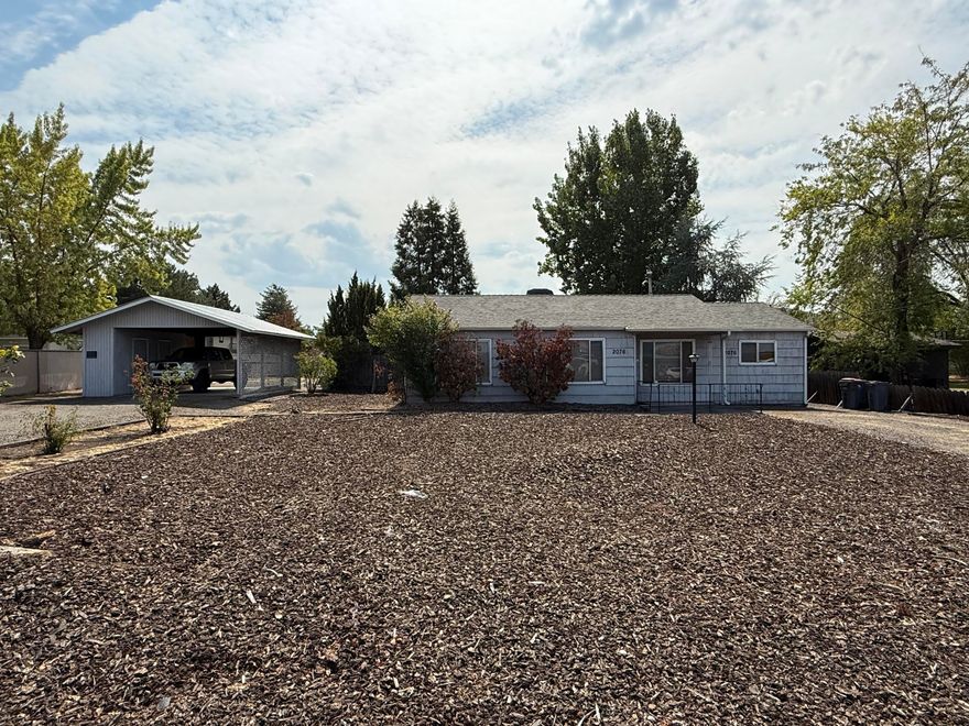 POTENTIAL DEVELOPMENT PROPERTY. Zoned MFR-20 with opportunity for multiple units. Prime location directly across from Grandview Shopping Center and close to North Medford High School, medical services, shopping, and transportation. The property is flat, usable land with an existing 3 bed / 1 bath home built in 1949 that has had some improvements. The home could possibly be updated or removed depending on how many units are approved and what direction the Buyer chooses. Power and utilities are nearby, making this a strong candidate for development. With its high-visibility location and strong demand for housing, this property offers excellent investment potential. Buyer to verify development possibilities with the City of Medford.