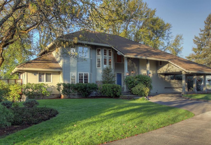 This luxurious 3 bedroom, 3 bath, 3,221 s/f John Magallon designed, Schmidke-built estate on the Rogue River with 200' of frontage is a dream home in a beautiful neighborhood! The grand hardwood entryway draws one into a perfect layout made for family and entertaining, from the window walls that overlook the lawns, gardens and River, to the soaring ceilings in the comfortable yet upscale living room, to the expansive decking, sport court, hot tub and patio areas! Celebration preparation is a pleasure in the high-end kitchen with abundant custom cabinetry, island & nook. Crown molding is a special feature! Comfort items include natural gas f/a heat with electric a/c. There's a 2 car attached garage, additional 1,256 s/f unfinished bsmt, plus a 'porte cochere' carport, RV parking and incredible professional landscaping. Life on the Rogue River is truly special: enjoy the wildlife (otters, bald eagles, osprey and abundant birds), and fish for salmon and steelhead in your own backyard!