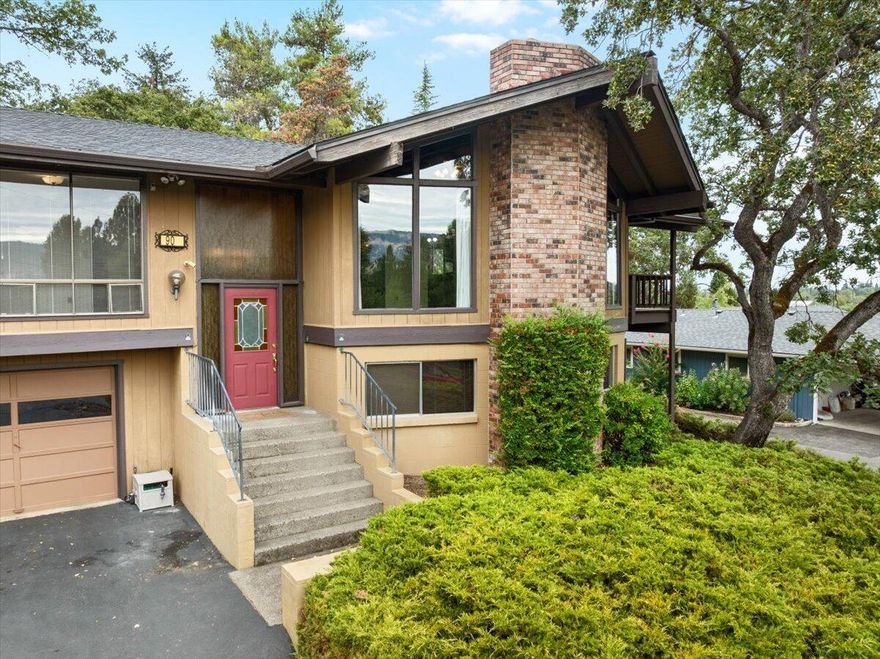 This mid-century contemporary is a true 70's classic—bold, bright, and full of character! You'll love the large windows with sweeping views, vaulted ceilings in the main living and dining room, and a wraparound deck made for relaxing or entertaining. With 2,422 sq ft of total living space, this home features 3 bedrooms, 2 full baths, abundant storage cabinets, and a finished daylight basement complete with a wet bar—great for relaxing or spending time with friends. There's also a fully finished detached storage space perfect for hobbies, creative projects, or extra room to spread out. All on a generous .37-acre lot.