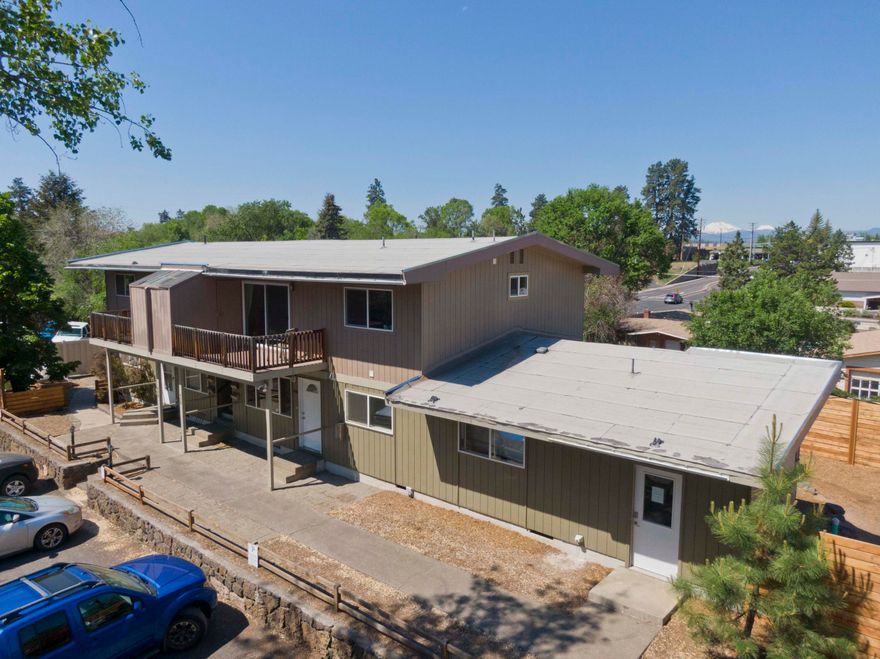 'Stories Mid-Town' fourplex is situated in a prime NE Bend location just 1 mile from downtown Bend in  desirable East Mid-Town and walking distance to Pilot Butte. A desirable unit mix (Three-2 bed/1 bath & One-3 bed/2 bath) with stable income in place. Two units are thoroughly updated. Current scheduled monthly rents equal $5,600 with additional upside. Subject property has well maintained grounds with bottom units featuring sizeable fenced yards (3 bed has 9x12 shed) and upper units have patio's. Tenants enjoy common areas, community garden and on-site laundry.