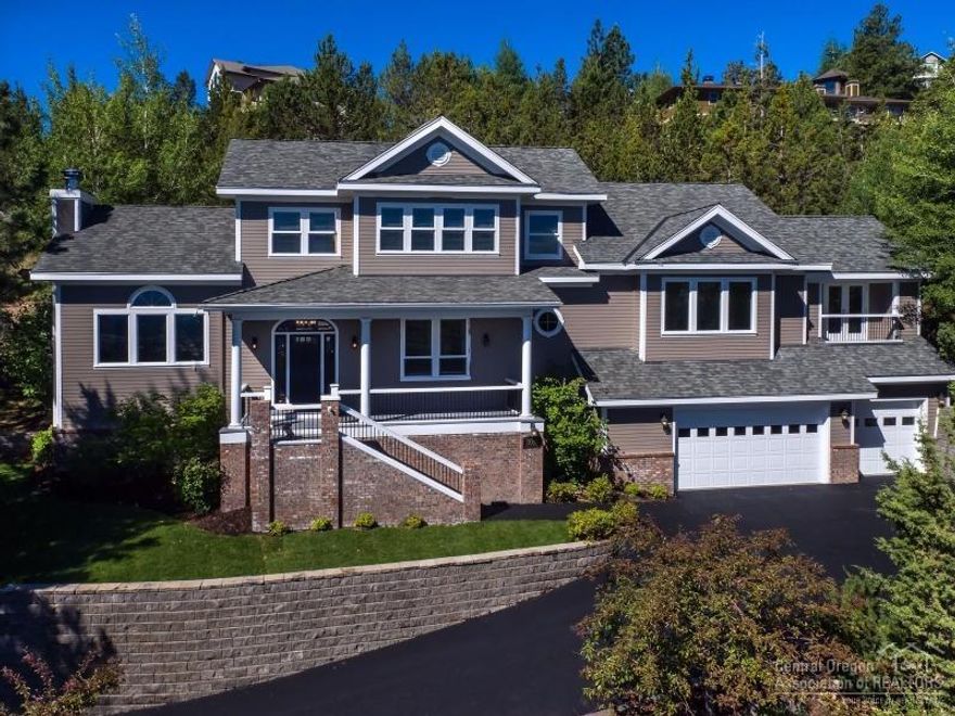 Traditional style home on Awbrey Butte is 3236 sf, 4 bedroom, 3.5 bathroom on .38 acres. Quality craftsmanship throughout with custom built-ins, cabinetry, crown moldings, and wainscoting. Home has a gourmet kitchen with granite counter tops and formal dining room. Master suite includes: soaking tub, walk-in closet and sitting area with entertainment center. Updates include new exterior paint and paved driveway. Home has a lot of natural light with views of the mountains, Smith Rock and city lights!