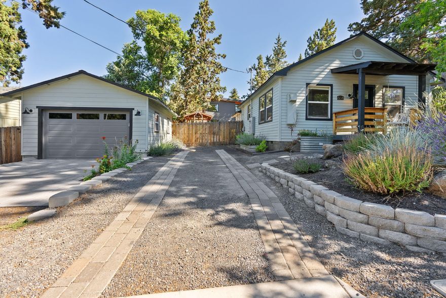 Nestled at the end of a quiet dead-end street in the true heart of Midtown, this charming .21-acre property offers a rare blend of historic character and modern flexibility. The main home showcases the timeless appeal of a classic Bend bungalow with tasteful updates throughout, while the nearly new ADU, completed in 2024, adds fresh, functional living space with views of Broken Top. Thoughtfully designed for privacy, both homes enjoy separation thanks to mature landscaping and generous spacing on the lot. Take in views of Mt. Bachelor from the welcoming front porch or enjoy the convenience of being just blocks from local favorites like the Yacht Club and within walking distance to downtown. Ample parking includes a 1.5 car detached garage for the main home and a spacious 1.5-car attached garage for the ADU. With both residences successfully rented over the past 18 months, this is a unique opportunity for investment, multigenerational living, or a live-in-one, rent-the-other lifestyle.