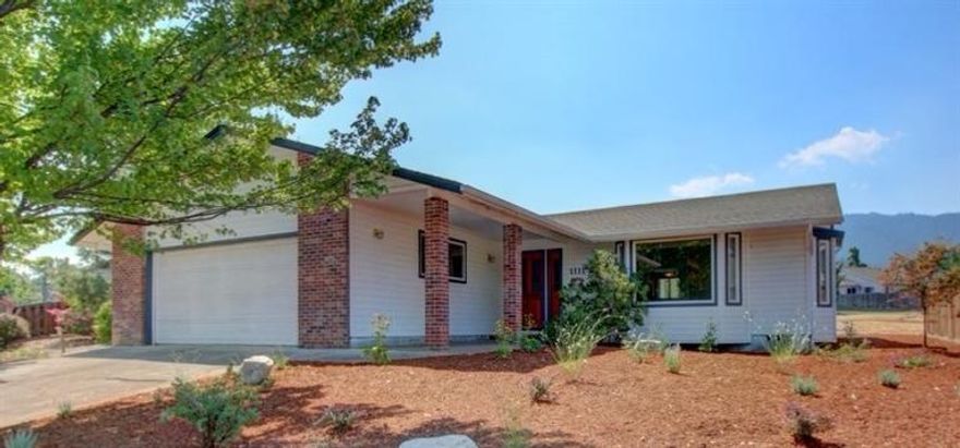 Fantastic home in a great neighborhood close to the Oak Knoll Golf Course. This home has a great location backing up to the large common area, with no close neighbor on one side & offering paths, a pond nearby & views of the mountain side. Just under 1900 sqft this super good sense home has a large open living area with bay windows & a huge kitchen with sitting peninsula & bar seating, tons of storage, granite counters and several pantry closets. Flooring consists of engineered wood floors, new carpet in the bedrooms, & vinyl in the bathrooms. Spacious guest rooms with a large master offering 2 large closets, built-ins, master bath with walk in shower. Small bonus room/ closet that could be used for storage, small office, sewing room or?? Conserve water with the newly installed easy care landscaping. 2 Car attached garage is finished and offers shelving and a work bench. There is even extra parking across the street.