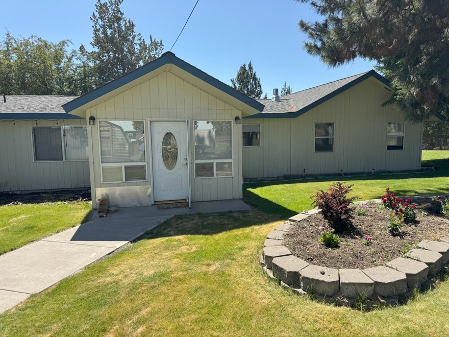 One mile from downtown Tumalo, the Bite, the school, the Deschutes River, the vibe. The home access crosses a shared driveway to very private setting on landscaped 1/2 acre. The rural feel without miles from services. Two bed with one bath and den/office could easily be the third bedroom. Peek-a boo views of the Three Sisters. Plenty of living /family area in the 2000 SF home. Garage has roll up doors with room for 2 cars and workshop area. There's a carport for additional toy (boat /RV) storage. Irrigation is served by Swalley Irrigation District with recorded buried pipe easement.. The home is vacant, cleaned, carpet cleaned and easily move in ready or ready for your vision.