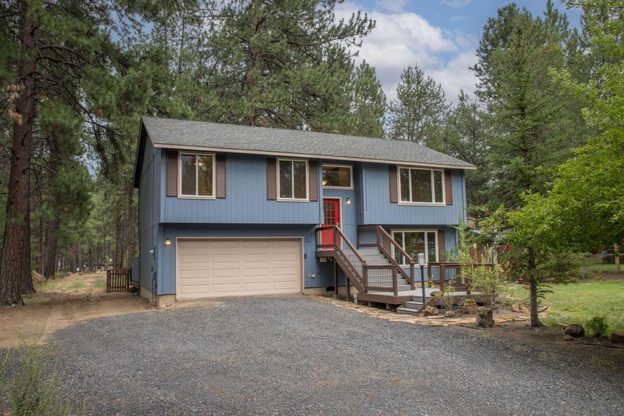 Nestled in a serene and pine treed neighborhood, this home offers the perfect blend of modern upgrades, outdoor living and Central Oregon charm. Situated on a large flat, fenced .9-acre lot, this property is an oasis for those seeking space, privacy and opportunities for outdoor recreation, including nearby access to amazing hiking and bike trails. The updated kitchen, which is the heart of the home, features pine cabinets, a locally crafted, one-of-a-kind countertop, farm sink, slow close drawers, a double oven and an expansive kitchen island - perfect for entertaining or casual meals. The open layout invites natural light, showcasing the home's warm and welcoming ambiance. The outdoor space is a true gem, offering a large deck ideal for relaxing and dining al fresco, or soaking in the hot tub under starry skies. The fenced back yard provides ample room for gardening, recreation and RV parking. A large, detached workshop with power is a dream for hobbyists.