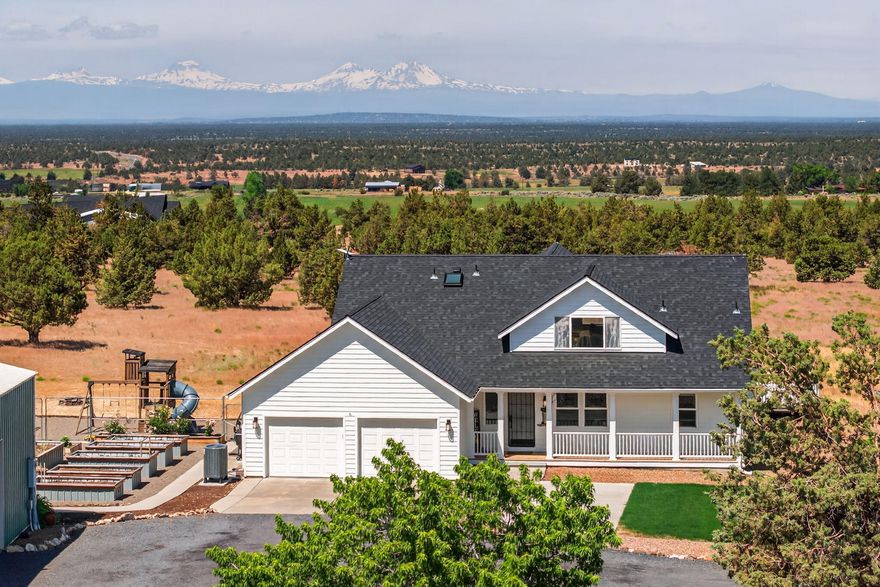 Situated on 10 acres in one of Central Oregon's most coveted locations, this exceptional Craftsman home offers an unparalleled combination of tranquility, expansive views, and proximity to Bend, Redmond, and Prineville. The property's prime position affords sweeping mountain vistas and a serene setting, all while remaining within easy reach of world-class recreation, dining, and amenities.
The home itself is a true masterpiece of craftsmanship, featuring custom woodwork throughout and an impeccable kitchen that serves as the heart of the home. With top-of-the-line appliances, elegant finishes, and abundant space for both culinary creativity and entertaining, this kitchen will satisfy even the most discerning.
The 10-acre parcel also includes a sizable shop and barn, providing flexible space for a variety of uses—from a hobby farm to equipment storage, or even a workshop for the most ambitious projects.
This rare offering is as much about the lifestyle as it is about the property—