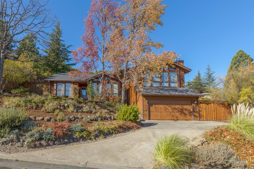 This meticulously maintained home shows pride of ownership throughout. With 4 bedrooms & 3 baths, the floorplan is quite versatile. It's situated in a quiet & well established neighborhood on a lush & private .24 acre lot. The vaulted, upper level family room boasts recessed lighting, fireplace, a wall of windows & unobstructed views of Grizzly Peak. Roomy formal living room with fireplace is adjacent to the dining area & a great spot for entertaining. New exterior paint, fencing, French doors, family room deck, landscaping, path lighting & the list goes on. There is tremendous storage throughout the home, including many built-in bookcases. The lower level fourth bedroom with full bath makes a great guest quarters. There is also an oversized laundry room with pantry & storage. There are numerous outdoor spaces for taking in the wonderful surroundings, sunrises and sunsets including an upper deck, rear deck off the main level and numerous sitting areas among the mature trees and shrubs.