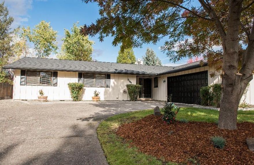 Desirable established East Medford nice upscale neighborhood with single level, 3 bedrooms, 2 baths plus office or formal dining room or potential to become 4th bedroom. Some new updates with Lg kitchen with white cabinets and island with breakfast bar that opens to family room and dining room with slider to patio and covered deck. Formal living room with floor to ceiling brick wood burning fireplace and slider to covered deck and beautiful private lg backyard with timed sprinklers in the front and back. RV parking, oversized finished 2 car garage master with lg tile shower and dbl sinks. Lg separate laundry room with storage and lg sink. Great home & location close to everything, shopping, fine restaurants, medical & Centennial golf course.