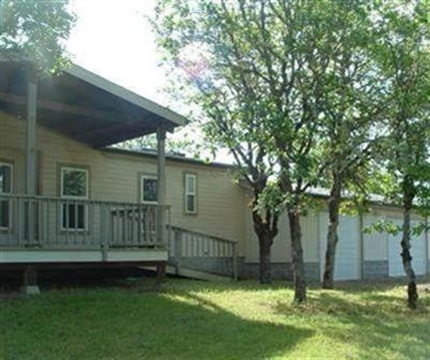 Owner financing available for qualified buyers! Beautiful large piece of land with just over 31 acres, perfect for someone who would enjoy their privacy! With lots of privacy and room to explore, yet still close enough to town. Large home with 4 rooms, 2 of which have closets! Open living room and kitchen with vaulted ceilings. Partially wooded and mostly level acreage.