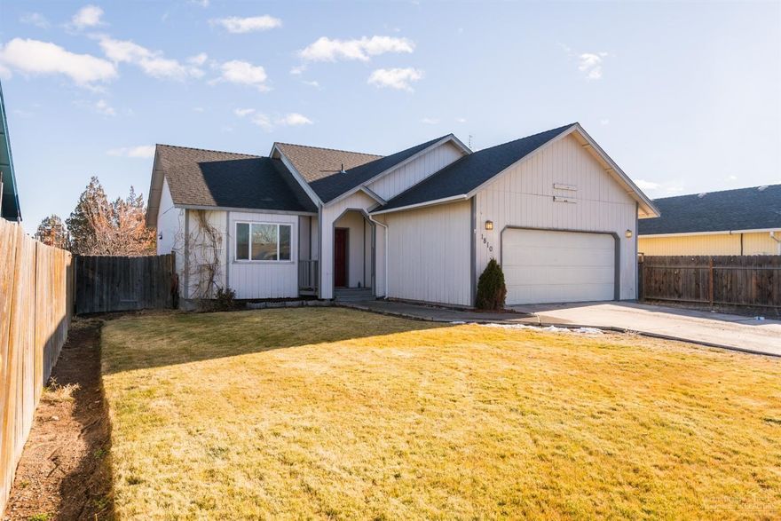 Newly updated single level home w/RV parking only blocks away from the Dry Canyon. The fresh paint & newer laminate flooring throughout the inside add nice detail w/cool & enjoyable colors & w/9 foot white ceilings throughout the lighting is excellent. Tile countertops & newly stained kitchen cabinets along w/the included stainless appliances make a great space for even the most discerning chefs. The master bedroom is adorned w/wainscoting & its bath has a tiled vanity. The guest bedrooms have a private view of the expansive back yard & the guest bathroom is completely remodeled. The utility room has newly re-stained cabinets & comes equipped w/the washer/dryer. Outside there is a large back deck & the yard is fully fenced. Behind the fence is a seating area/fire pit right next to the canal & it's a great space for a garden and/or green house. Behind the canal a very accessible additional 35'x60' piece of land makes a great place for additional vehicle, RV, & trailer parking.