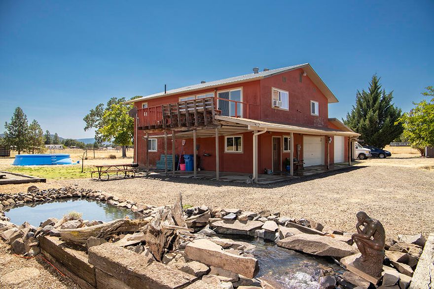 This charming 2 bedroom home is located on 5 acres of flat, usable land. The home has beautiful views of the surrounding mountains and is perfect for those who love the peace and quiet of rural living.  Features include a large second floor living room, a kitchen with tons of storage space, and a deck overlooking the entire valley.  Downstairs you will find a master bedroom with its own private bathroom, as well as a large bonus space that could be finished off and used as an office, playroom, or whatever you'd like!  The property also includes a barn with pastures, perfect for your animals to enjoy.  Not to mention, a strong well with approx 7 year old pump, and RV parking with hookups and dump.  Come see for yourself all that this property has to offer