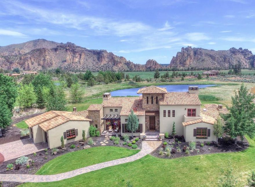 Gorgeous Tuscan Lake House in Ranch at the Canyons, located at the base of Smith Rock. Set alongside a 2 mile stretch of the Crooked River, the Ranch provides some of the best views, recreation, & privacy Central Oregon offers. Features: 3 Master Suites, open kitchen & greatroom w/high ceilings & large windows, exposed beams, stone accents, Viking range, limestone counters, comfortable outdoor living, & views at every turn. Access: Clubhouse, Stables, Vineyard, and just 15min to Redmond Airport.