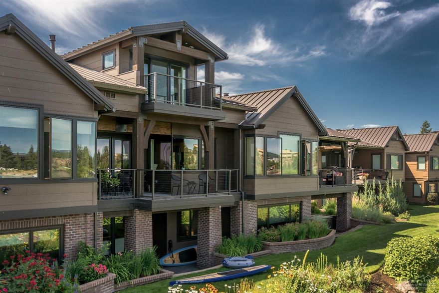 This finely appointed town home on the banks of the Deschutes river provides beauty,joy & recreation. Living here offers you river, trail & Old Mill District access. The fine details that went into the construction of the residence leave you w/ peace of mind. The quality is apparent from the moment you step through the front door. Gourmet kitchen, Bonus room with wet bar, 2 family rooms. 3 riverfront patios. Kitchen, entry, family rooms & master all over look the river. Embrace the natural light & quality