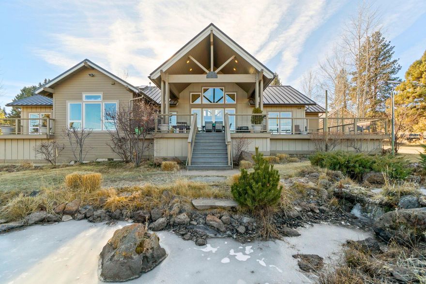 Nestled in Bend's countryside, this 2,494SF single-level home offers a blend of comfort & functionality w/ Structural Insulated Panels(SIP framing) for ultimate building standards. Boasting 3 beds & 2 baths, the thoughtfully designed floor plan ensures seamless living & effortless entertaining. Enjoy the vaulted ceilings create a sense of spaciousness, w/ a chef's kitchen equipped w/ gas cooktop, pantry, perfect for culinary enthusiasts. The primary suite includes a luxurious walk-in shower w/ heated shower. Additionally, the property includes a separate 700SF artisan studio w/ full bath, A spacious heated woodworking shop, plus an insulated 2 car garage. 20 private acres, w/ 5.6 acres of water rights, a large pond, creek, stunning landscaping, Cascade Mountain views & joins Public Land. Your perfect rural retreat awaits just moments from Tumalo eateries & new Costco!